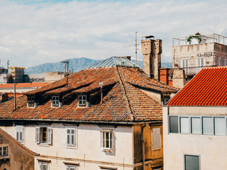 Fototapeta na wymiar Orange tiles on the roof. Croatian architecture.