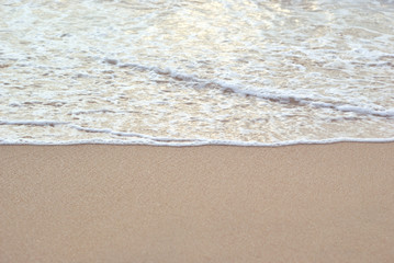 Sea wave and beach sand