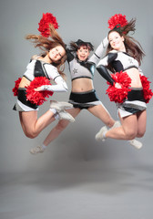 Three Cheerleaders Jumping