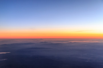 View of Aegean region of turkey from sky with mist on mountains