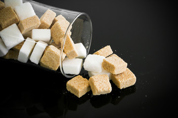 Sugar cube on black table 
