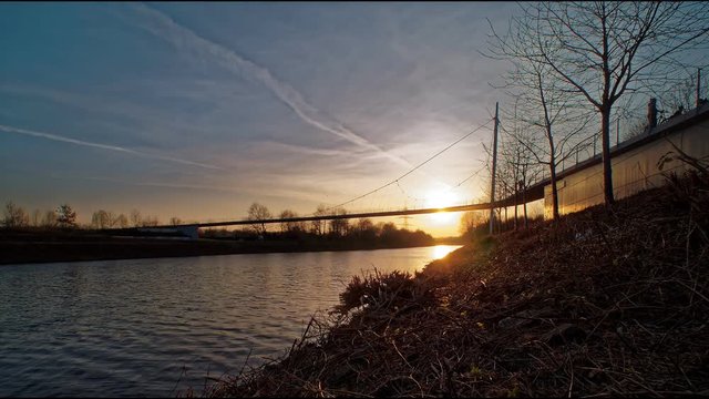Bridge over canal sunset time laps 