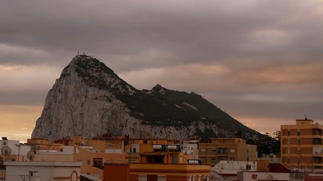 Dramatic morning time-lapse of Gibraltar Rock and La Linea de la Concepcion cityscape in Spain.