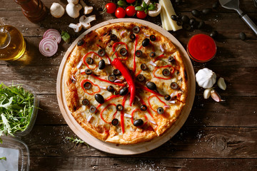 top view pizza with fresh red pepper and ingredients on table.
