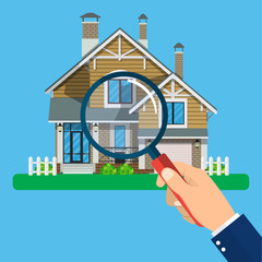 Magnifying glass with house.