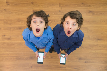 The two surprised twin phone. View from above