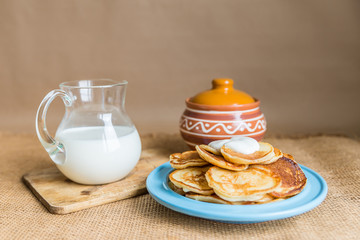 pancakes with jam, sour cream and milk
