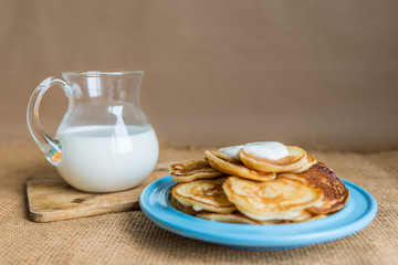 pancakes with jam, sour cream and milk