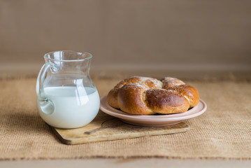 bun with butter and milk