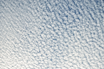 Seamless pattern of clouds on blue sky