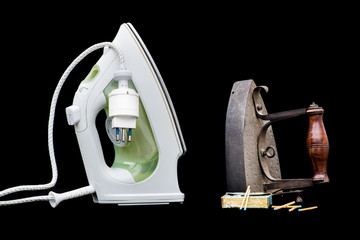Vintage coal flat iron and modern steam iron. Concept of progress, contrast new old, evolution, development, well being, change, improvement 