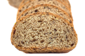 Dark rye bread with seeds on white background