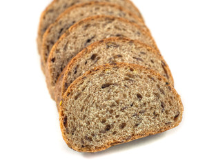 Dark rye bread with seeds on white background