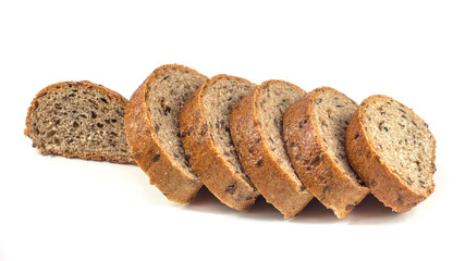 Dark rye bread with seeds on white background