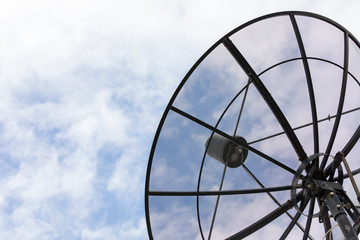 big satellite dish on blue sky background in sunny day