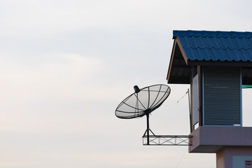 Satellite dish on roof and half of roof
