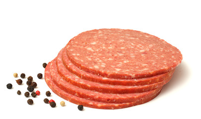 sliced red salami isolated on white background