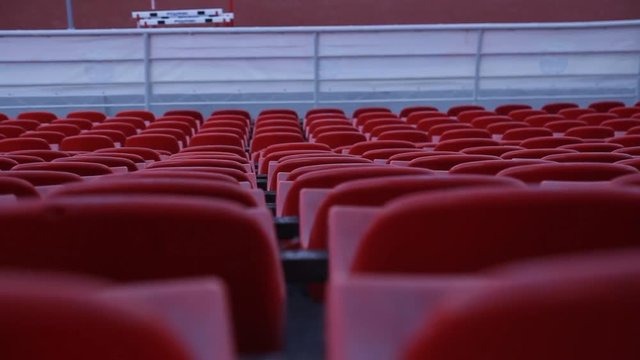 Tribune of the stadium. Plastic seats on the tribune of the football stadium.
