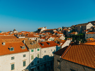 Dubrovnik Old Town, Croatia. Tiled roofs of houses. Church in the city. City View from the wall.