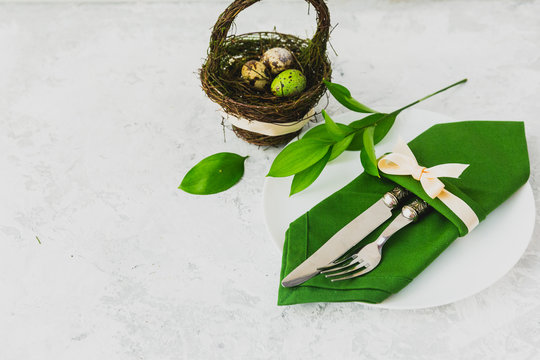 Fork with knife, blank plates, and napkin. Easter table settings. Top view. - Powered by Adobe