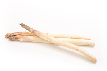 Three white asparagus spears, on white background