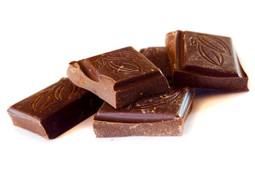 A few pieces of chocolate on a white background