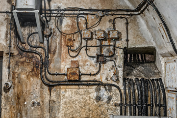 Old network electrical cables on the wall