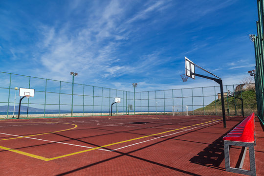 Sports playground for basketball and football by the sea
