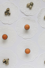 Selection of Eggs on White Table Covered with Vintage Doilies