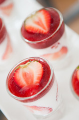 Close-up shot of dessert strawberry with whip cream.