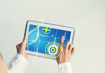 Close of female doctor hands working with tablet pc computer