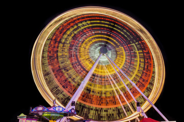 Freak Ferris wheel at Matejska Fair in Prague. Long time at night.