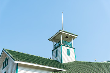 The ancient white observatory  and green roof tile with blue sky
