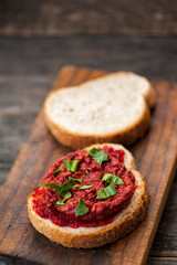 Vegetarian beetroot sandwich with egg, spinach and red chili jam