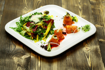 Red fish rolls and salad