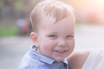 Cute happy baby boy smiling