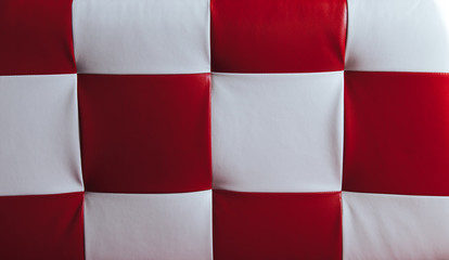.Texture of leatherette with red and white squares