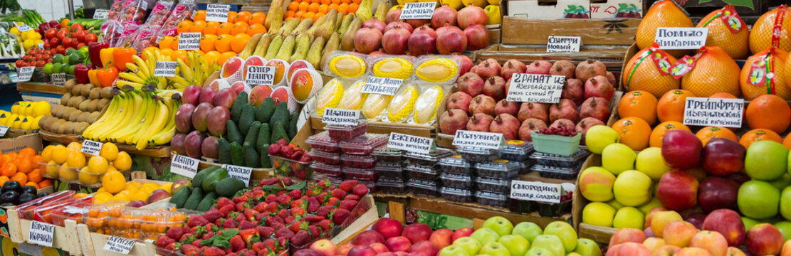 A variety of fruits and berries on the counter on the market. Russia, Saratov.