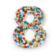 Number 8 eight. Set of alphabet of medicine pills, capsules, tablets and blisters isolated on white.
