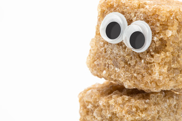 brown sugar monster with googly eyes on white background
