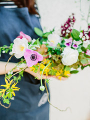 Beautiful floral composition and woman florist. Wedding decor.
