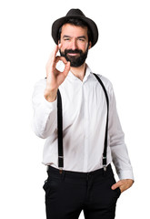 Hipster man with beard making OK sign