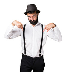 Hipster man with beard pointing down
