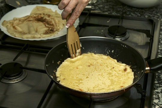 frying pan in the kitchen preparing crepes and pancakes