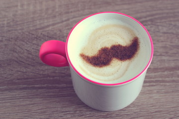 cup of cappuccino with cinnamon, mustache, retro style, hipster, vintage