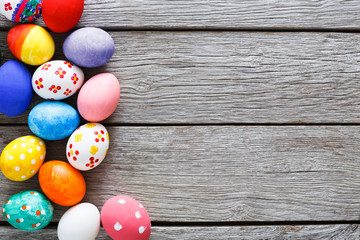 Colorful easter eggs on wood background
