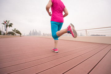 woman running on the promenade