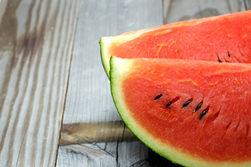 Watermelon slice on wooden.