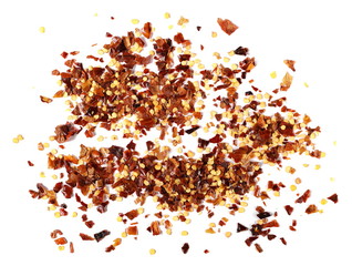 pile crushed red pepper, dried chili flakes and seeds isolated on white background, top view
