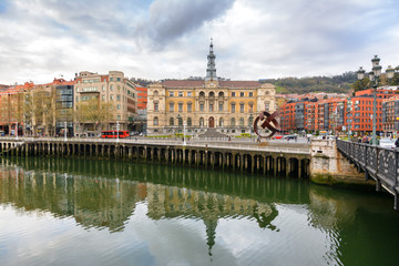 Bilbao town hall reflected at river, Spain